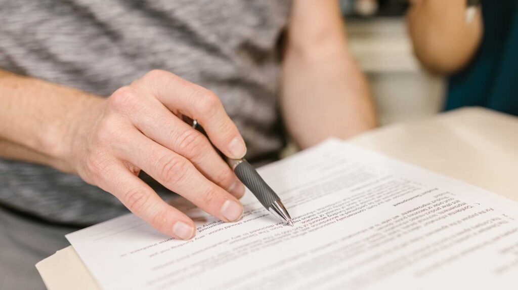 Person examining legal services document.